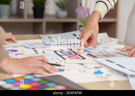 Women designers collaborating on UI UX mobile app wireframe planning Stock Photo