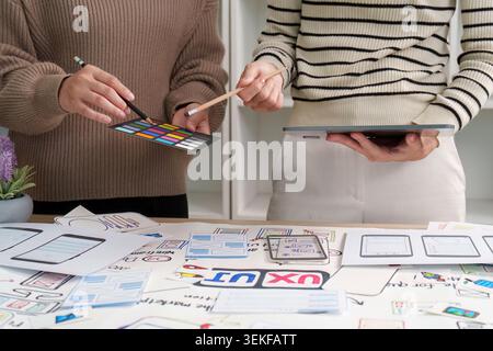 Women designers collaborating on UI UX mobile app development Stock Photo