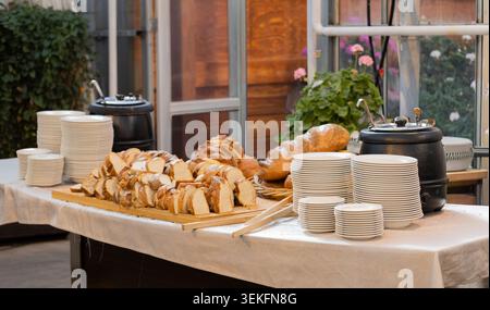 Freshly baked bread selection on buffet table inside greenhouse restaurant in Iceland Stock Photo
