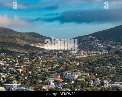 Coastal suburb by inland dune between hills on Cape Peninsula, Cape Town Stock Photo