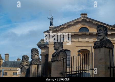The Emperor Heads, stone busts outside the Sheldonian Theatre in central Oxford, university city in England, UK Stock Photo