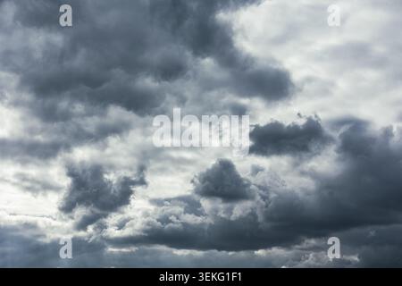 Gray cloudy sky. Dramatic clouds in the dark sky. Stock Photo