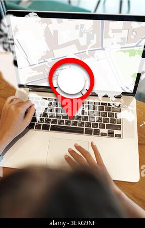 Finding taxi locations on a map using a laptop in a travel setting Stock Photo