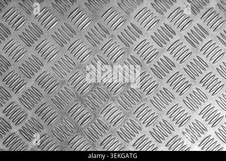 A silver metal diamond plate surface. Stock Photo