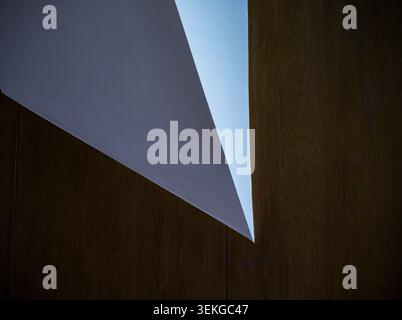 Abstract Minimalist Architecture with Geometric Triangles and Natural Wood Textur Stock Photo