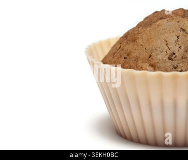 Half of a chocolate muffin in a beige silicone baking cup isolated on a white background with copy paste Stock Photo