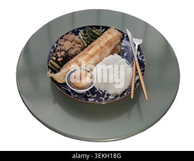 a Japanese set meal presented circular tabletop isolated on a white background with clipping path, a deep-blue patterned ceramic plate is a beautifull Stock Photo