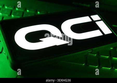 Quantum Computing Inc Company Logo On Screen Display With Computer Technology Keyboard Background And Advanced Quantum Technology Workspace Stock Photo