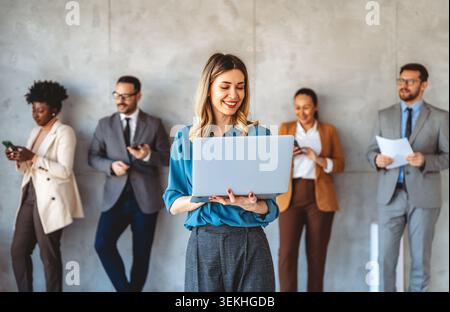 Team of programmers writing digital code in the metaverse and working together on the internet Stock Photo