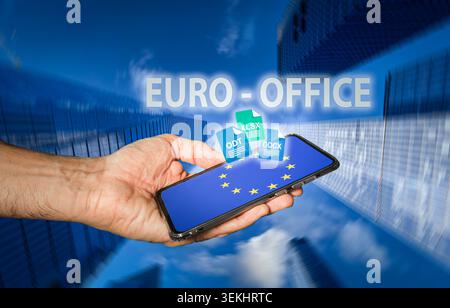 Hand holding smartphone showing EU flag on screen with digital document icons rising out, symbolizing European software, online document management, d Stock Photo