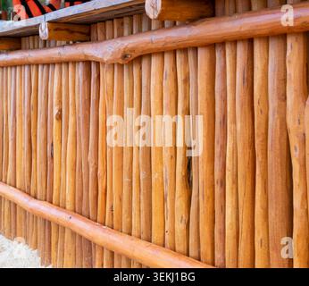 angled view of a bunch of round wooden log together Stock Photo