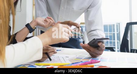Team of UI UX web designer are working together to develop mobile responsive websites with UI UX front end designer previews Stock Photo