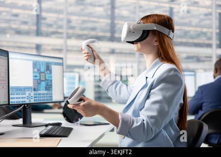 Testing microchip electronics prototypes, VR technology and woman in office. Ensuring industrial hardware standards, virtual reality headset and female engineer in semiconductors RD laboratory Stock Photo