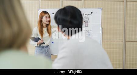 UI designers present to team about color design of logo during application design brainstorming. Creative digital development agency. UX UI concept Stock Photo