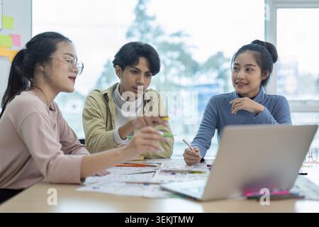 Team of ux developer and ui designer brainstorming interface wireframe design. Creative digital development agency Stock Photo
