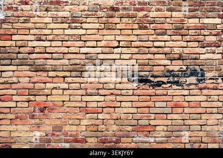 Texture, brick, wall, it can be used as a background. Brick texture with scratches and cracks Stock Photo