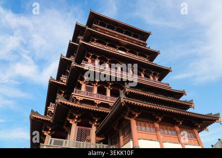 Dramatic low angle view of the intricate wooden roof layers of the monumental Tianhan Building in Hanzhong, Shaanxi, China Stock Photo