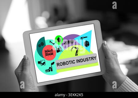 Robotic industry concept shown on a tablet held by a woman Stock Photo