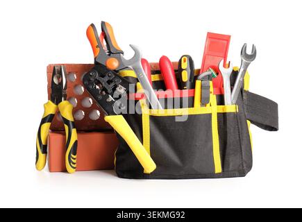 Tool belt with set of construction tools and bricks isolated on white background Stock Photo