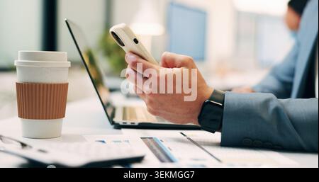 Business, texting or hands in office with phone, funding request or online chat on portfolio update. Contact, man or finance consultant with laptop Stock Photo
