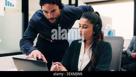 Telemarketing, team and sales agent in office with laptop, data analysis and advice for performance. Consultant, people and discussion in call center Stock Photo