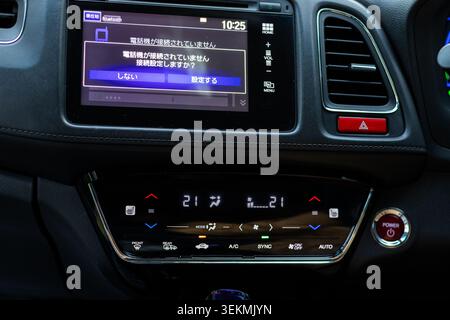 Modern Hybrid Car Infotainment System and Digital Climate Control Dashboard Interior. Modern Car Interior Dashboard Touchscreen and Climate Control Pa Stock Photo