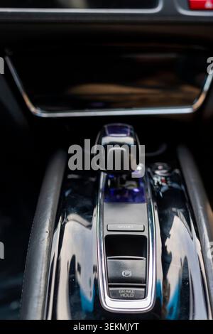 Automatic Gear Shifter and Electronic Parking Brake in Modern Car Interior Stock Photo
