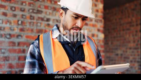 Confused, engineer or man at construction site with tablet, building problem or bad news for project. Person, reading and tech with doubt for Stock Photo