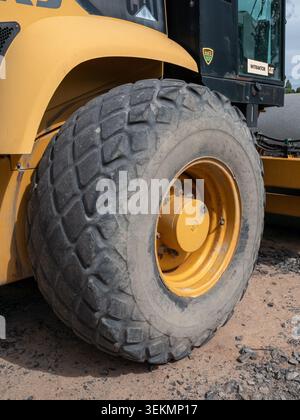 Heavy yellow construction loader tire close-up Stock Photo