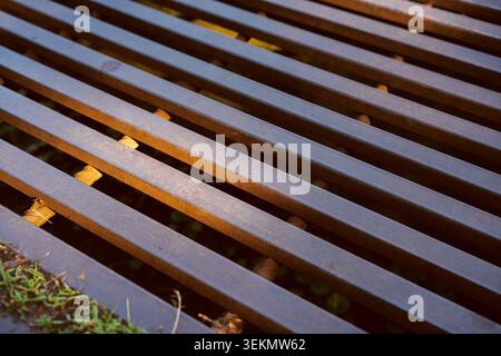 Industrial metal grate pattern with rusty iron bars and linear geometric structure background Stock Photo