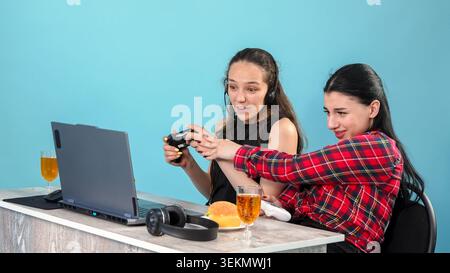 Two creative young female colleagues working together at office table desk Stock Photo