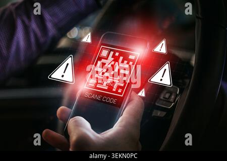 Scam message appears on mobile phone while driving a car in the evening Stock Photo