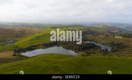 Aerial view of the rolling green hills and lush forests of the ...
