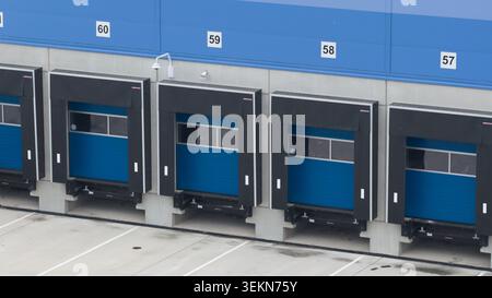 Multiple loading docks at modern distribution center facility Stock Photo