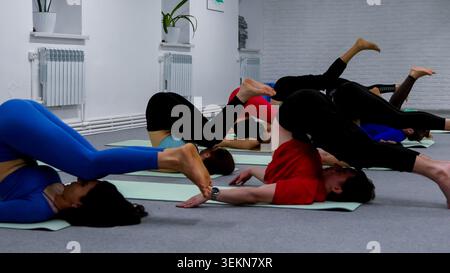 Wellness lifestyle concept featuring group of women doing stretching exercise Stock Photo
