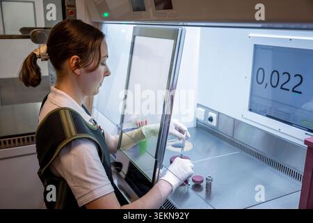 Scientist examining DNA samples while working in laboratory Stock Photo