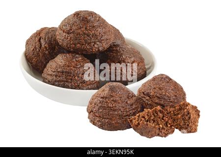 chocolate cookie with kerob,, sunflower seeds in ceramic bowl isolated on white background. Healthy food gluten-free, flour-free Stock Photo