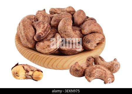 cashew nuts heap with shell in wooden bowl isolated on white background Stock Photo