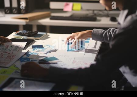 Team of Program Developer Collaborating on UXUI Design Planning in a Modern Office Environment Stock Photo