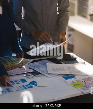 Team of Program Developer Collaborating on UXUI Design Planning in a Modern Office Environment Stock Photo