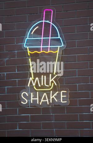 Gorzow Wielkopolski, Poland - 05.30.2026 The "Milk Shake" neon sign is made of flexible LED neon and features a stylised image of a glass of milkshake Stock Photo