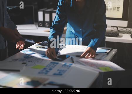 Team of Program Developer Collaborating on UXUI Design Planning in a Modern Office Environment Stock Photo