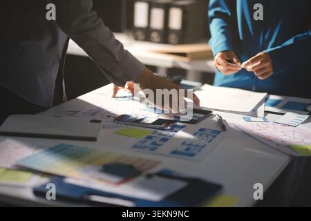 Team of Program Developer Collaborating on UXUI Design Planning in a Modern Office Environment Stock Photo