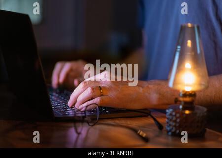 Midsection of businessman using laptop at home Stock Photo