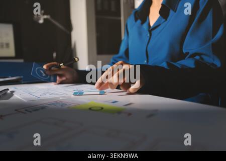 Team of Program Developer Collaborating on UXUI Design Planning in a Modern Office Environment Stock Photo