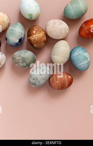 Colorful painted eggs on beige surface Stock Photo