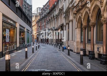 This narrow, cobbled lane is Throgmorton Street in the financial heart of the City of London. It serves as a hub for banking  and  financial services. Stock Photo