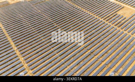 Large solar panel array in Coria del Rio, Seville, Spain. Capturing sun energy, generating clean electricity for sustainability Stock Photo