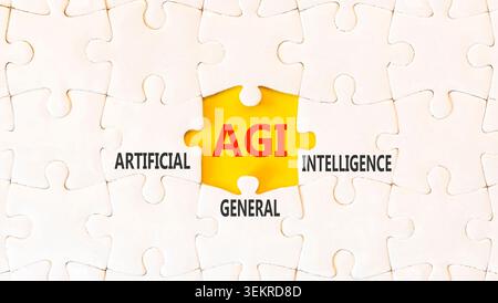 AGI artificial general intelligence symbol. Concept words AGI artificial general intelligence on beautiful white puzzles. Beautiful yellow background. Stock Photo