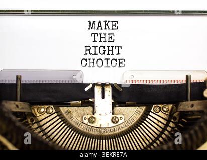 Make the right choice symbol. Concept words phrase Make the right choice typed on beautiful retro old typewriter. Beautiful white background. Business Stock Photo
